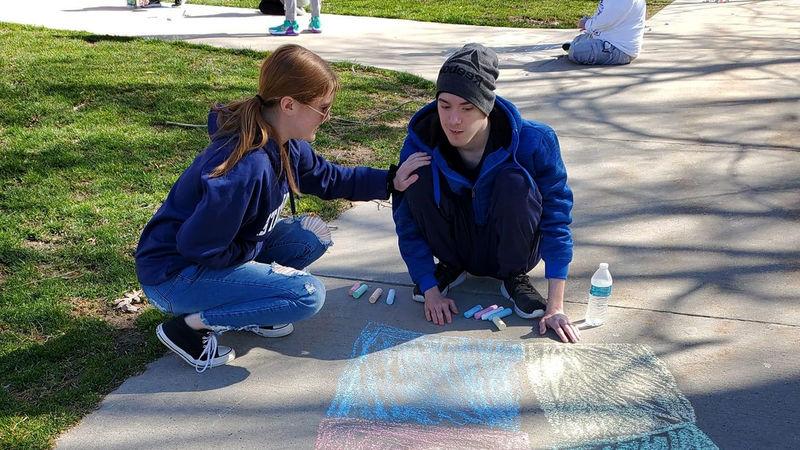 Carson and Sydney at a sidewalk chalk event through Penn State Altoona’s student organization We Are Friends.